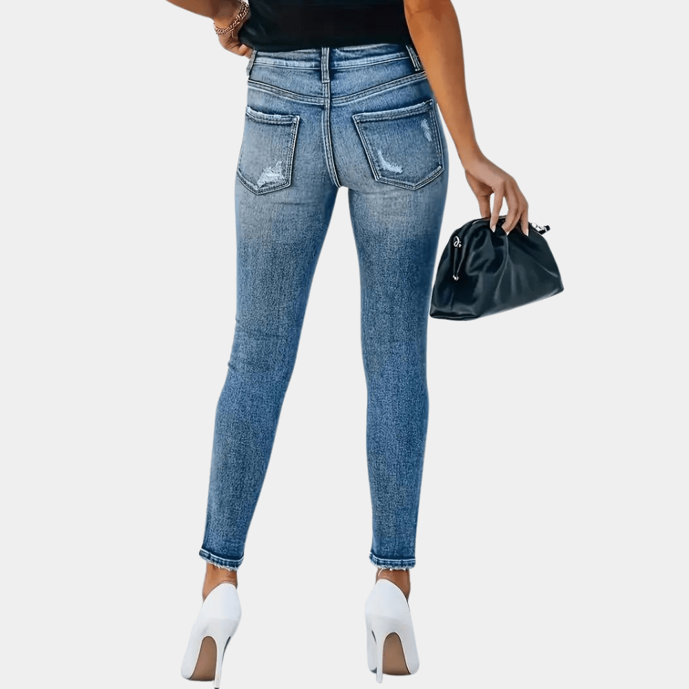 High Waisted Skinny Jeans with Distressed Detail and Multi-Button Fly