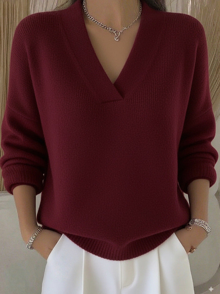 Relaxed Knit Sweater with Deep V-Neckline and Ribbed Hem